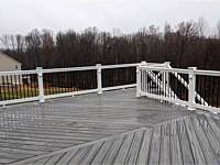 <b>Trex Transcend Island Mist deck boards in a Herringbone layout with White Washington Vinyl Railing and Black Round Aluminum Balusters in Eldersburg, MD 2</b>